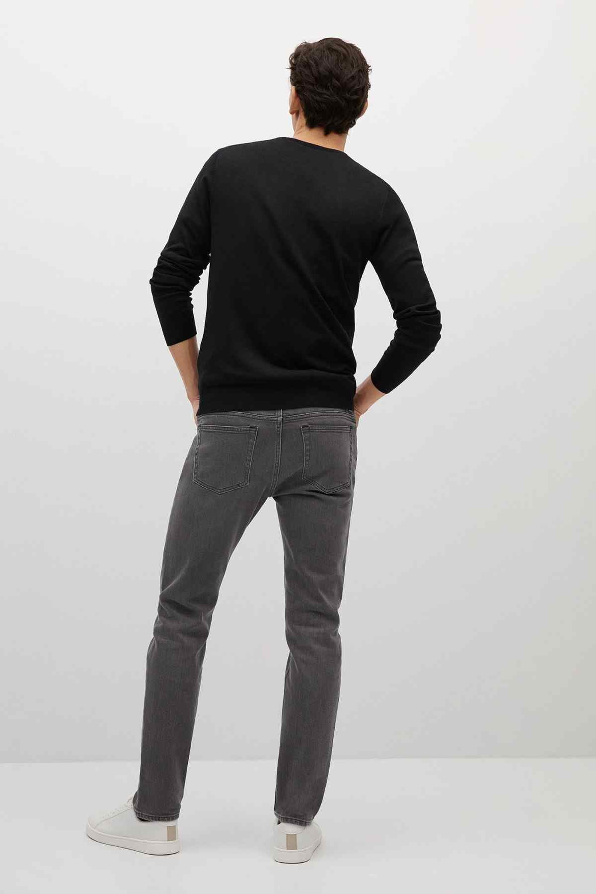 Back view of denim grey straight-leg jeans with belt loops and five-pocket styling