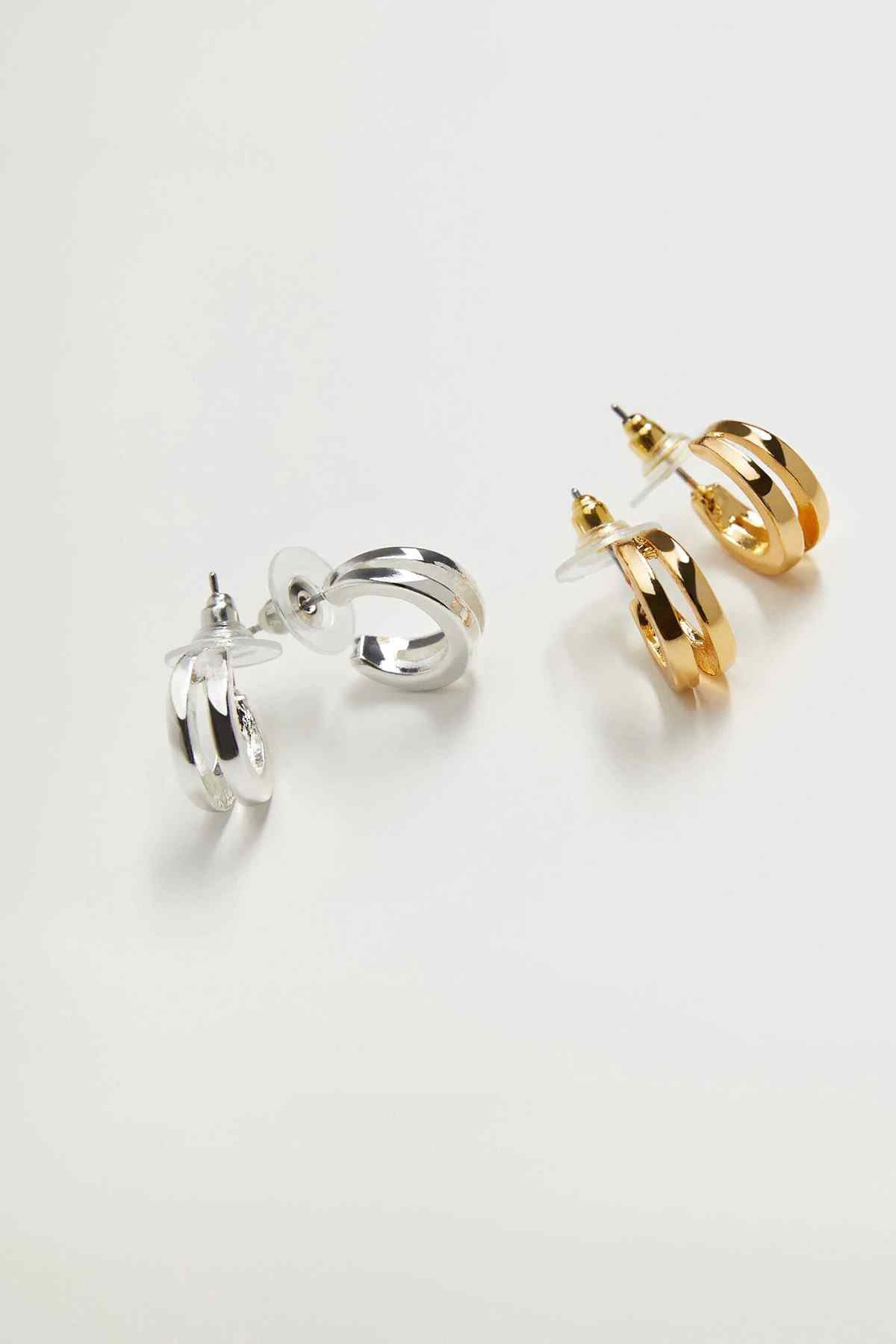 Silver and gold hoop earrings with circular rings and gold dangle detailing