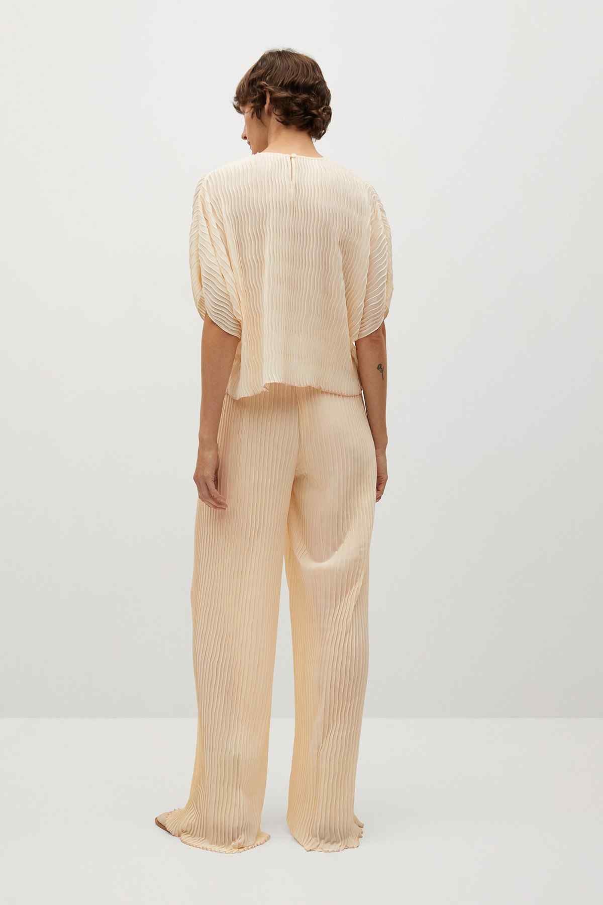 Off-white striped wide-leg pants, back view with elastic waist and ankle length