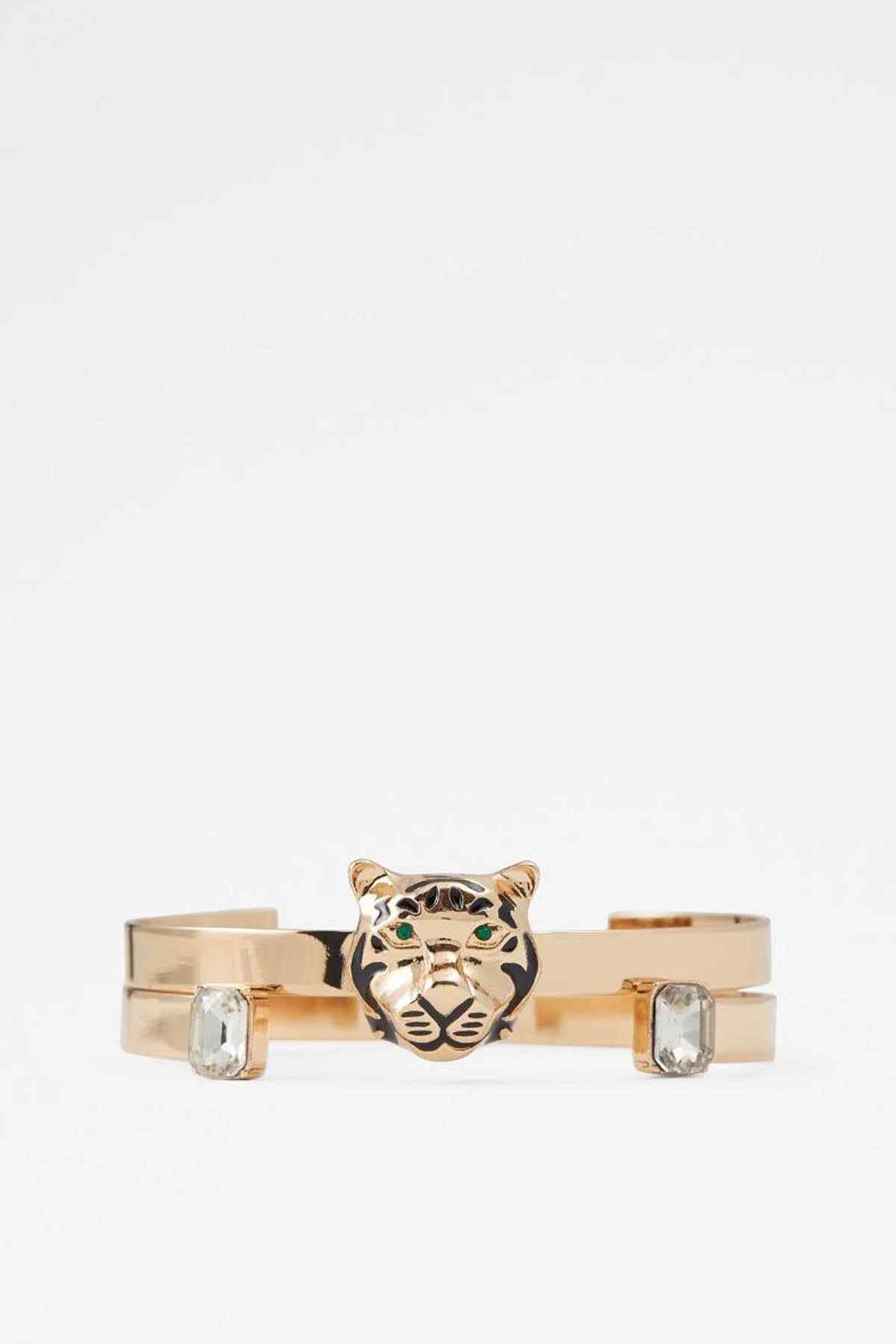 ALDO gold tiger face cuff bracelet with clear stone accents