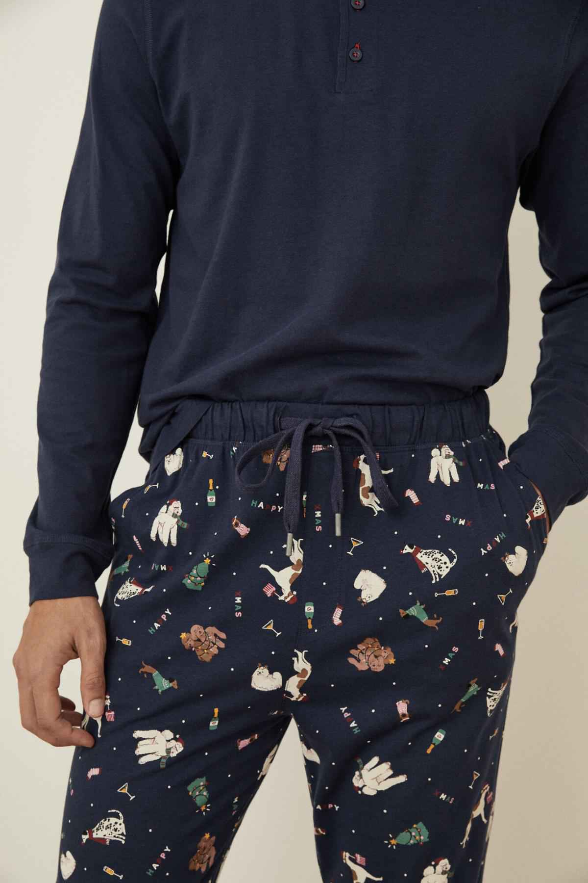 Men's navy henley pajama top with long sleeves and matching patterned drawstring pants