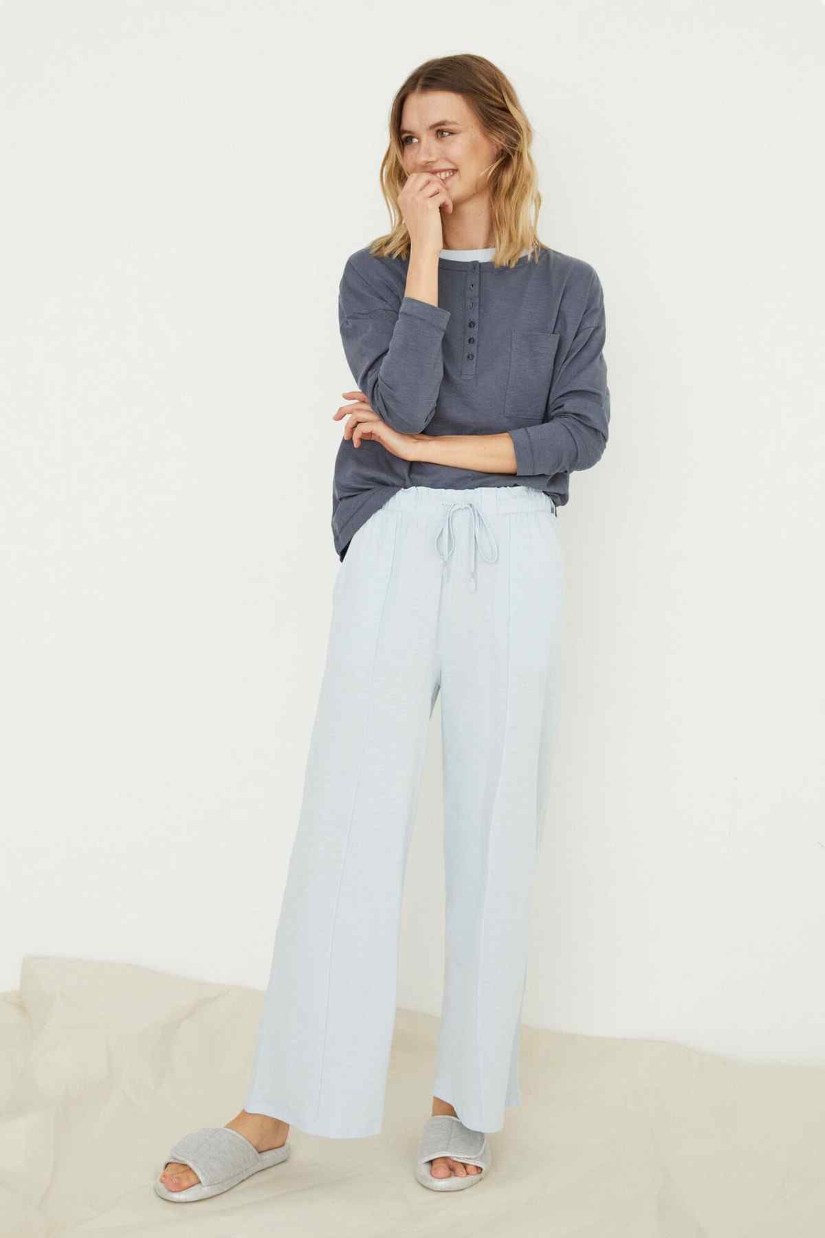 Light blue wide-leg pajama pants with drawstring waist, side view