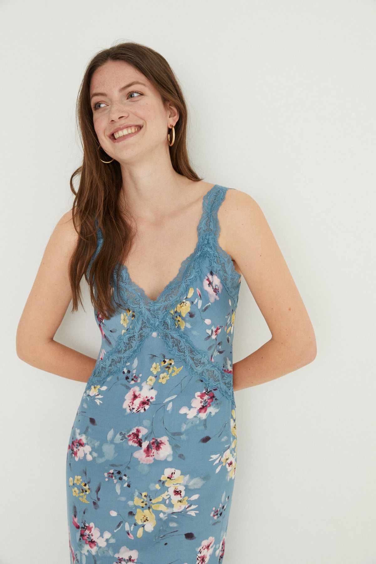 Women'secret floral slip dress front view with lace V-neck and shoulder straps, blue