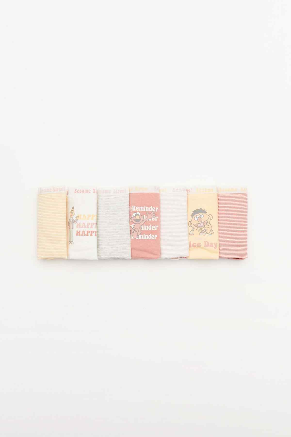 Five-pack of folded bikini briefs with pastel colors and stripe/cartoon prints