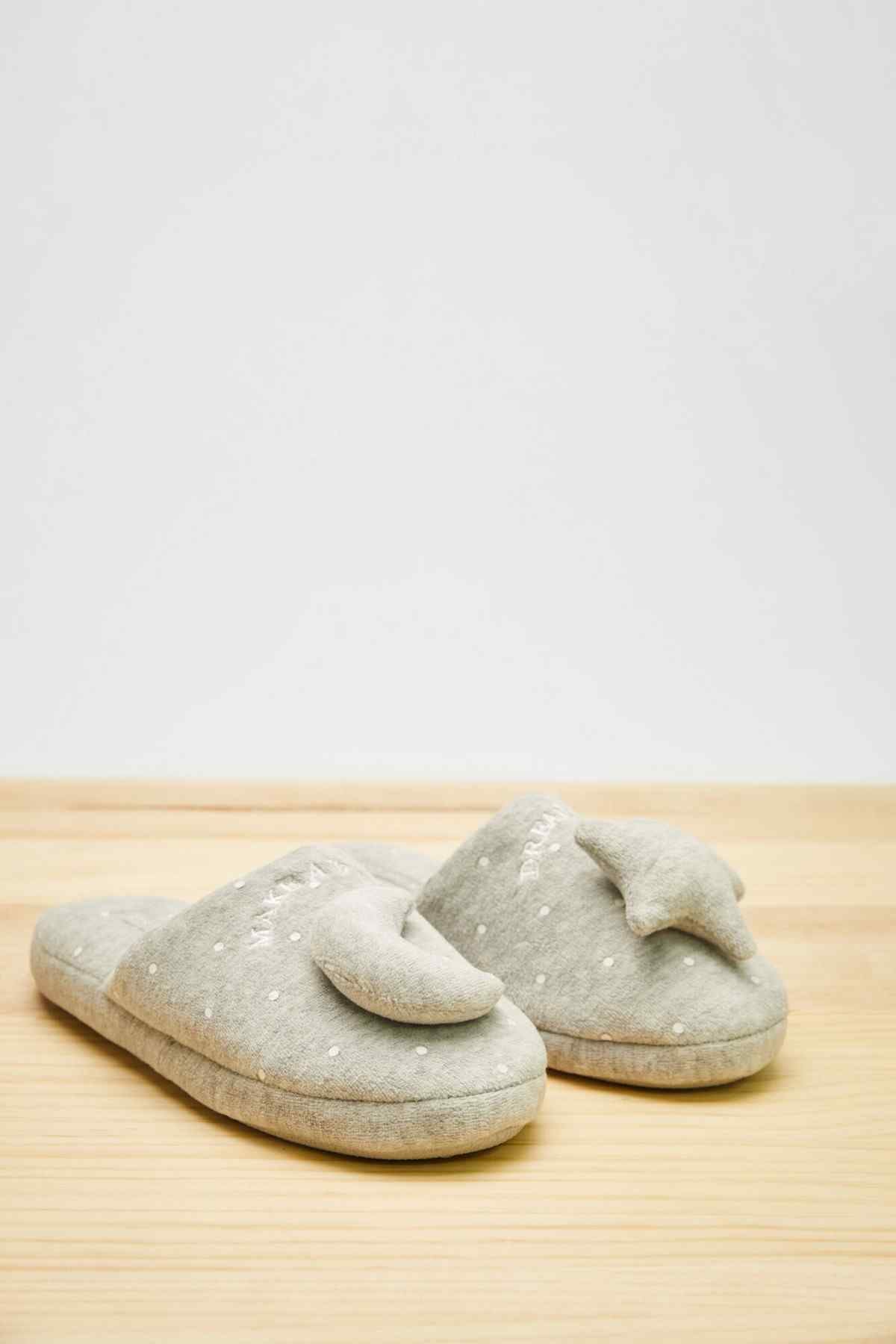 Dark gray speckled slide slippers with curved toe and cushioned footbed