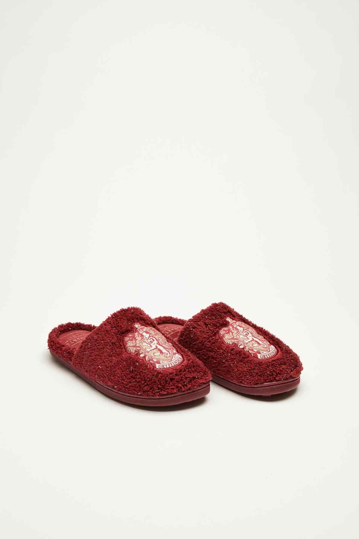 Dark red fuzzy slide slippers with embroidered crest on vamp