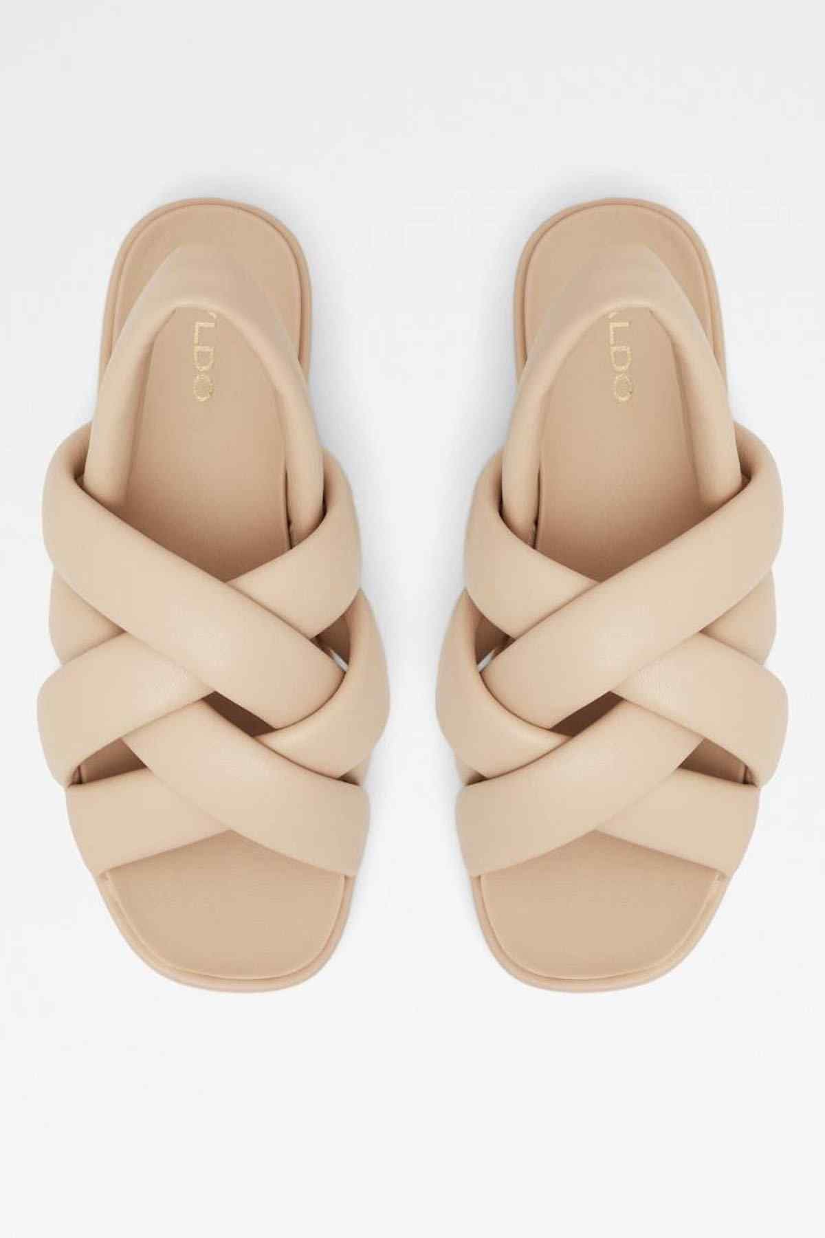 Pair of bone crisscross platform sandals, open toe and cushioned footbed