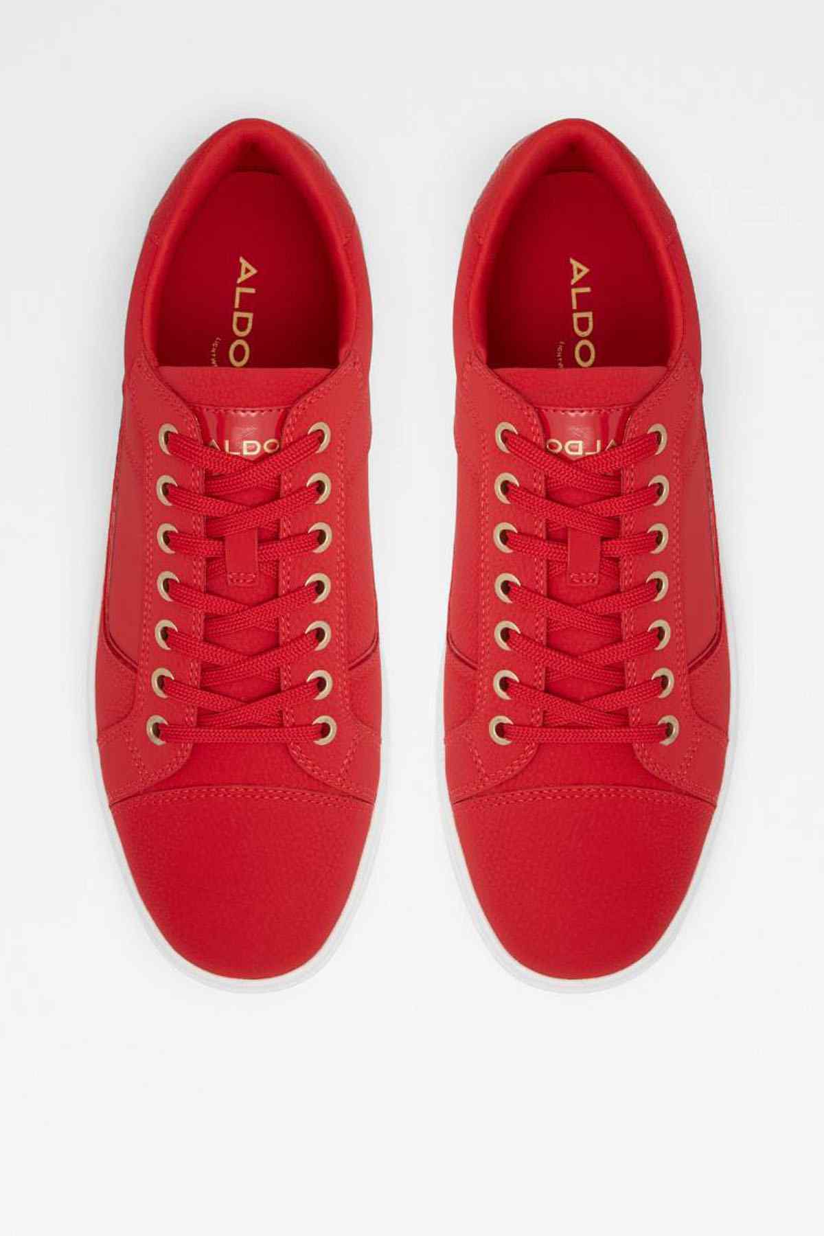 Red ALDO sneakers from above, with laces and logo on tongue