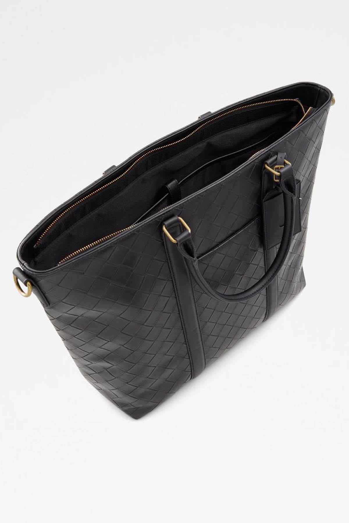Black woven leather tote bag with zip top, dual handles, and gold-tone hardware