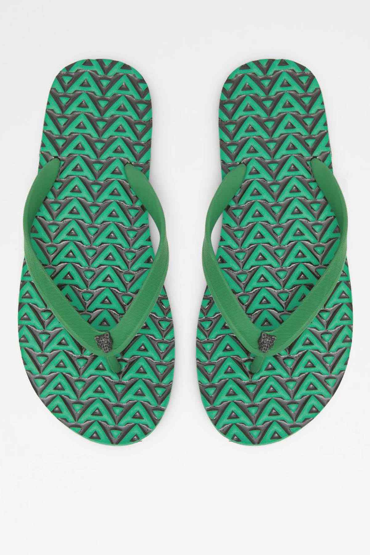 Pair of green ALDO thong sandals showing patterned tread and footbeds