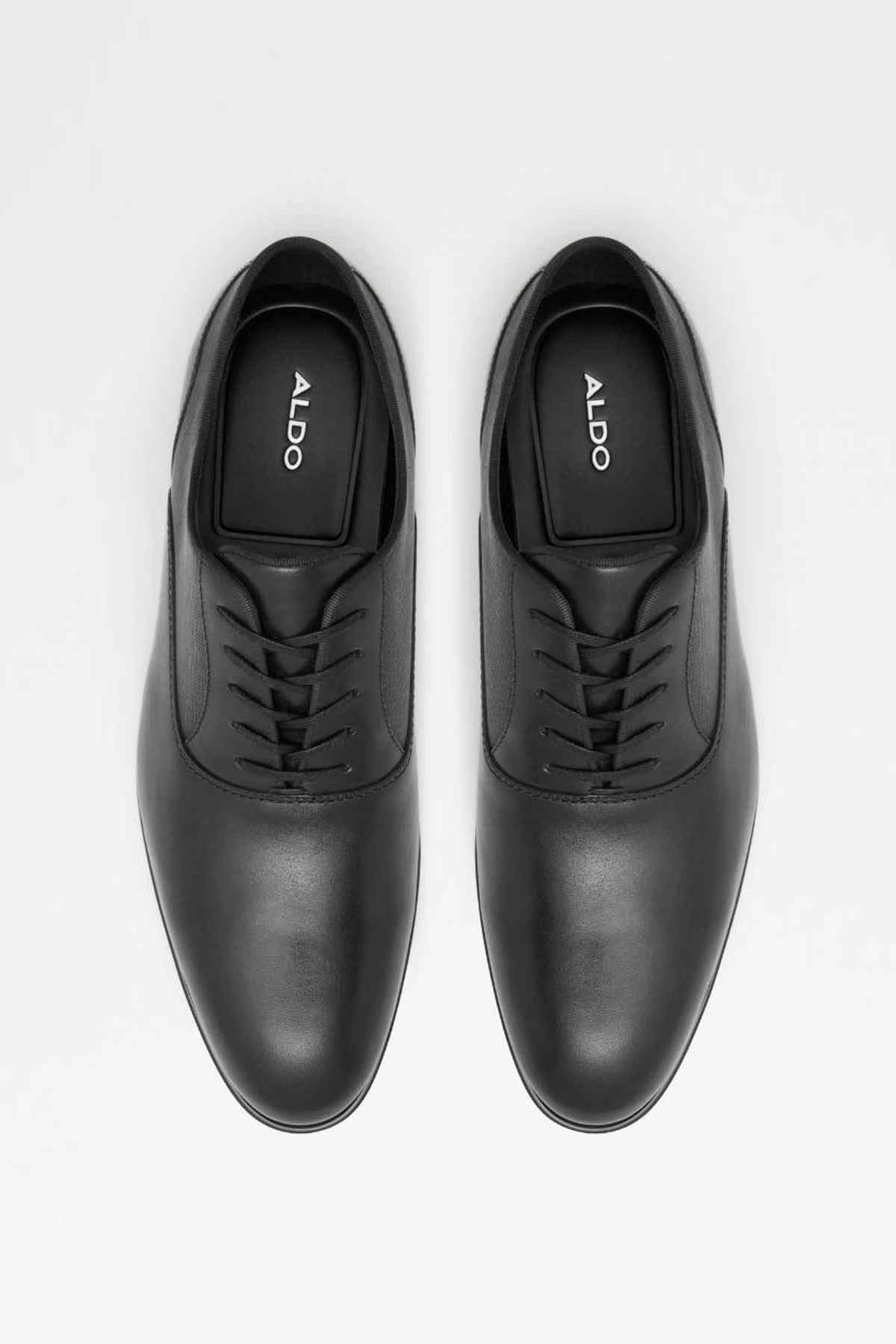 Pair of black leather lace-up dress shoes with ALDO logo on tongue