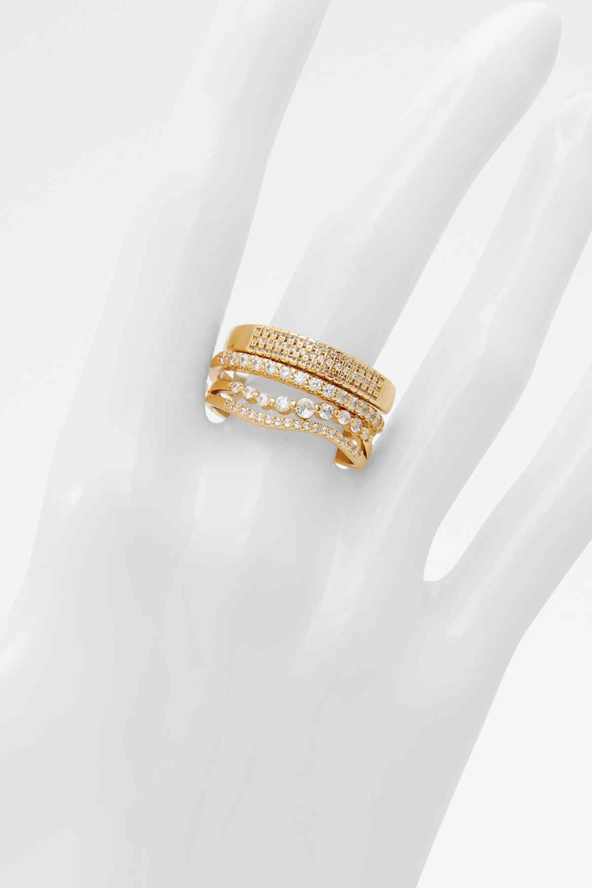 Gold-tone rhinestone band ring on mannequin hand, multi-row clear stones
