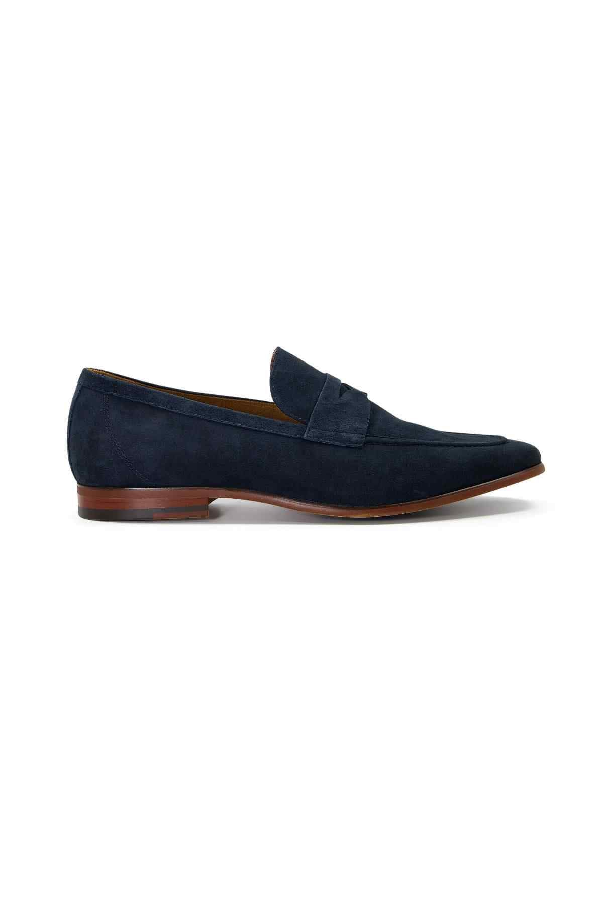 Navy suede loafer front side view with stitched strap and low brown heel