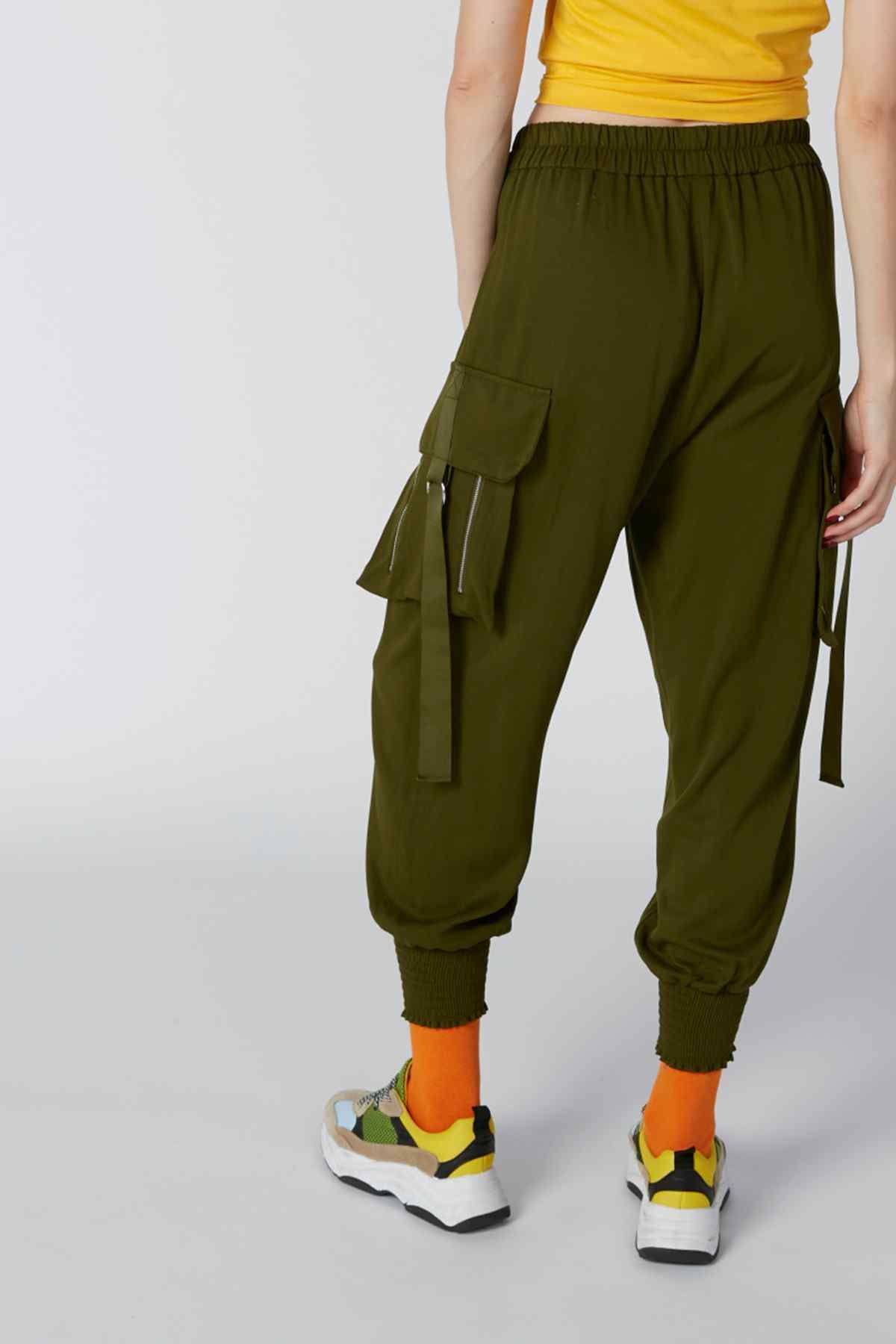 Olive green cargo jogger pants with elastic cuffs, drawstring waist, and side pocket