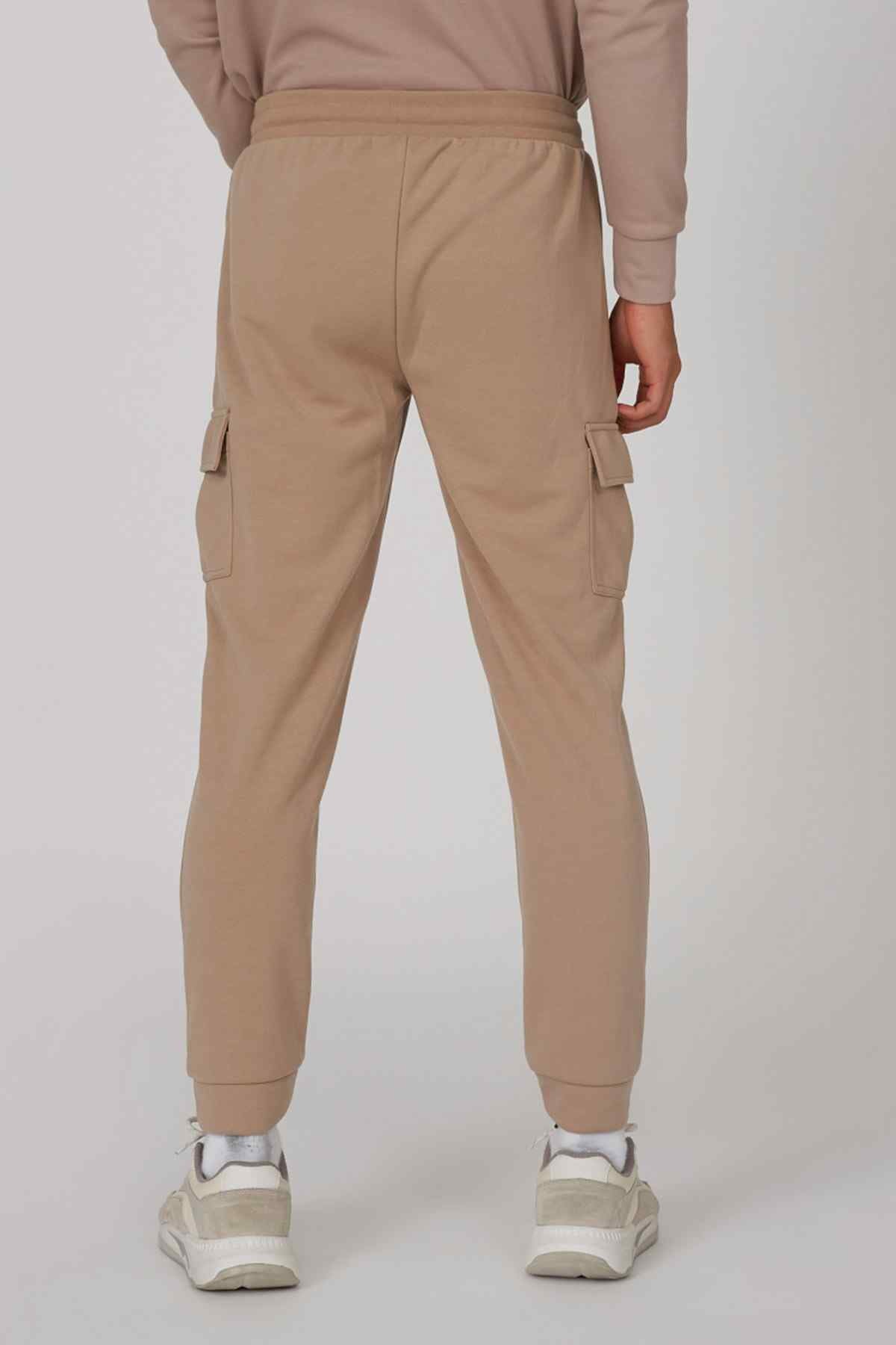 Brown cargo jogger pants, elastic waistband, side flap pockets, tapered cuff hem