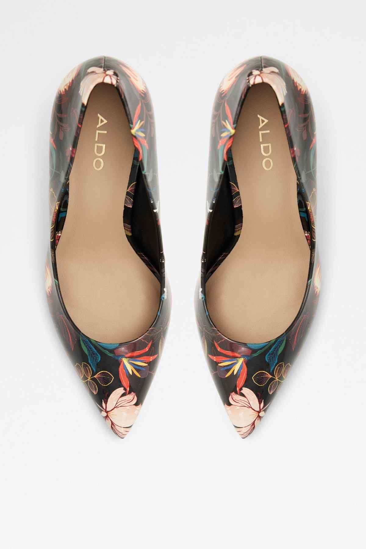 Pair of black multicolor floral print pointed-toe pumps, showing inner lining.