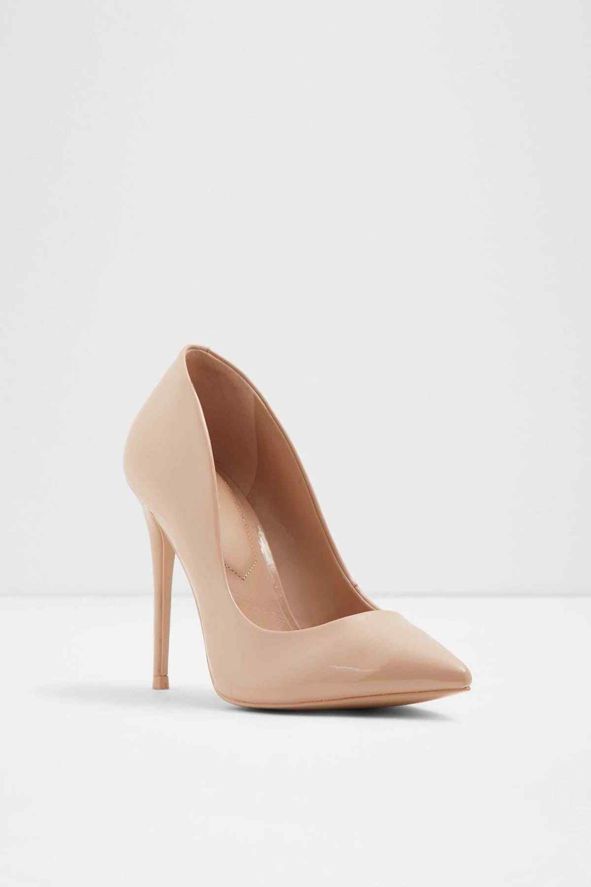 Beige patent pointed-toe pumps with slim stiletto heel, front 3/4 view