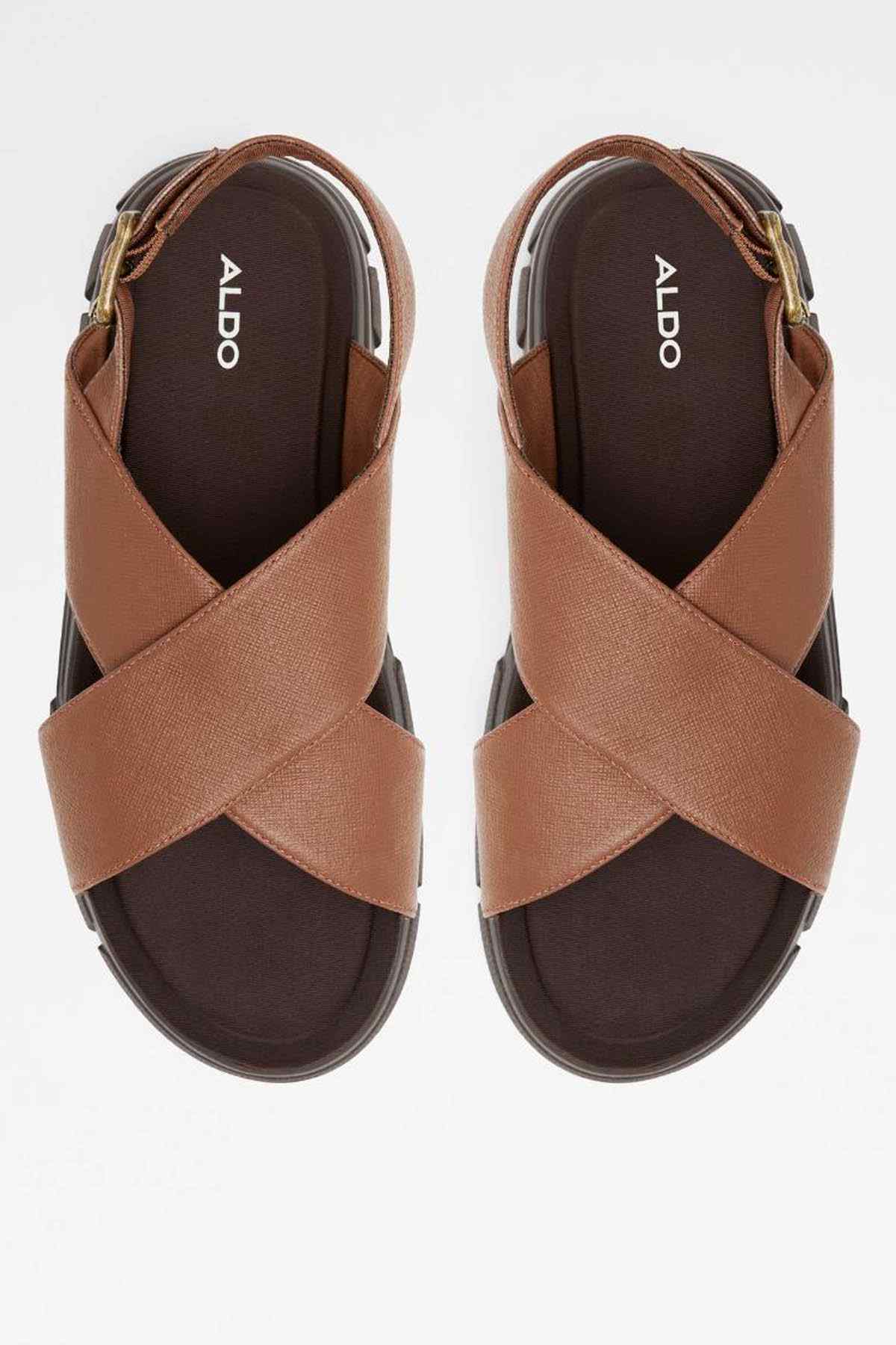 Pair of ALDO Cognac sandals with crisscross straps and adjustable side buckle