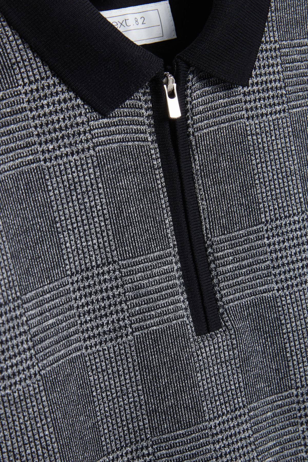 Quarter-zip detail on textured grey check polo top with black collar