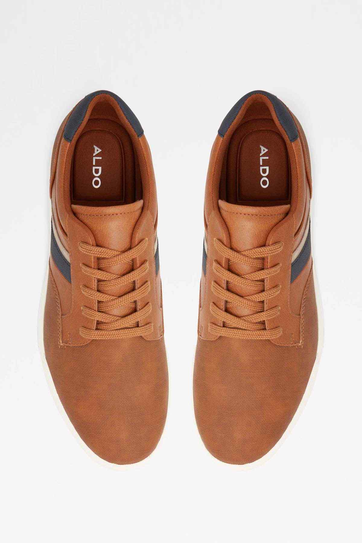 Light brown lace-up sneakers with navy side stripe and white rubber sole