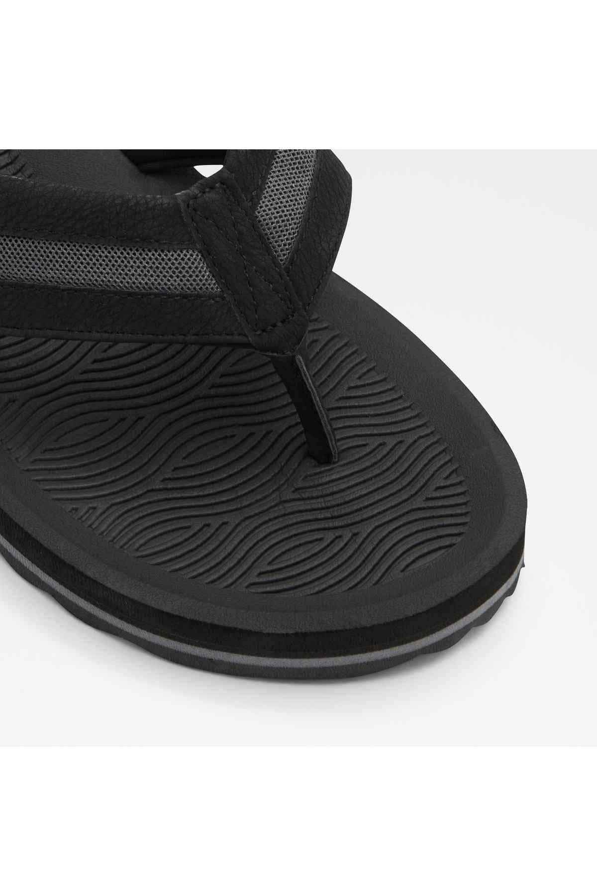 ALDO black flip-flops close-up of textured insole and outsole tread