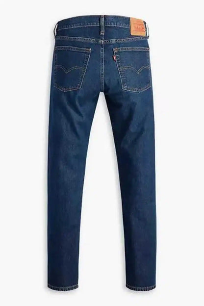 Levi's dark indigo denim jeans, front view with five-pocket styling and button fly