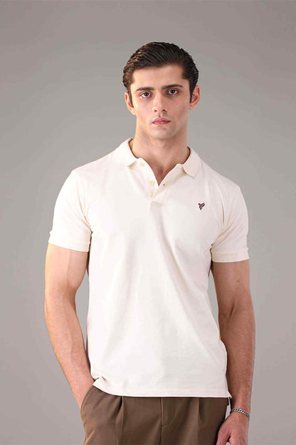 Fitted white polo shirt close-up with collar, button placket, and chest logo