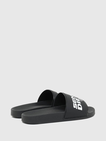 Diesel black slide sandals with logo slide strap and wide sole