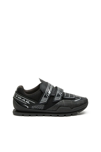Black trail sneakers with hook-and-loop straps and chunky rubber outsole