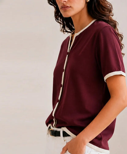 Fitted burgundy henley top, short sleeves with white edging and front button placket