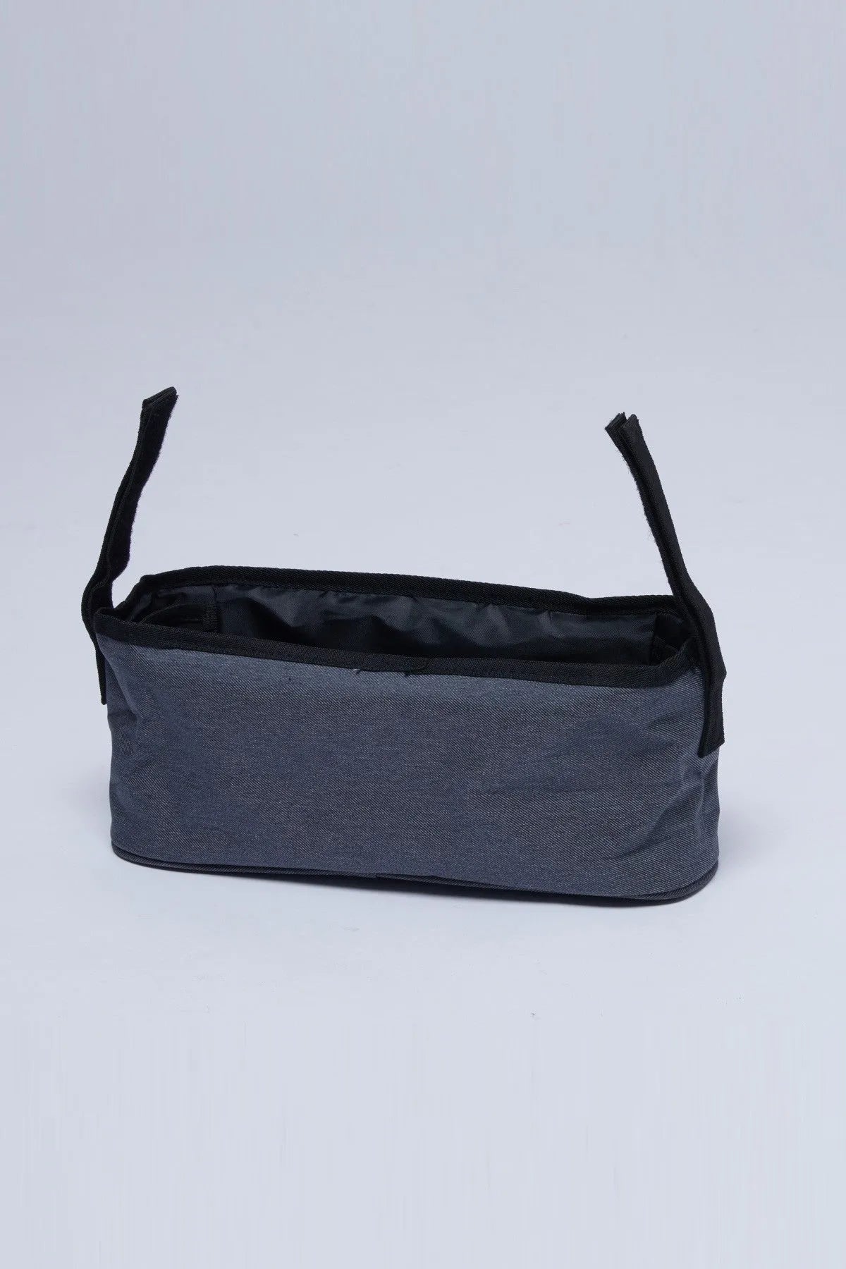 Grey stroller organizer bag with open top and black side handles