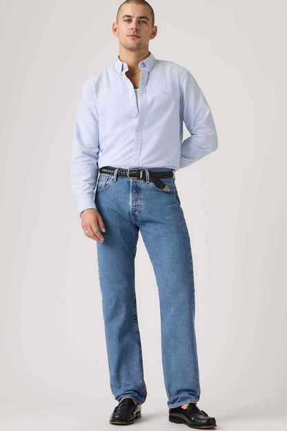 Men's blue denim jeans with worn-in wash, relaxed fit, and belt loops