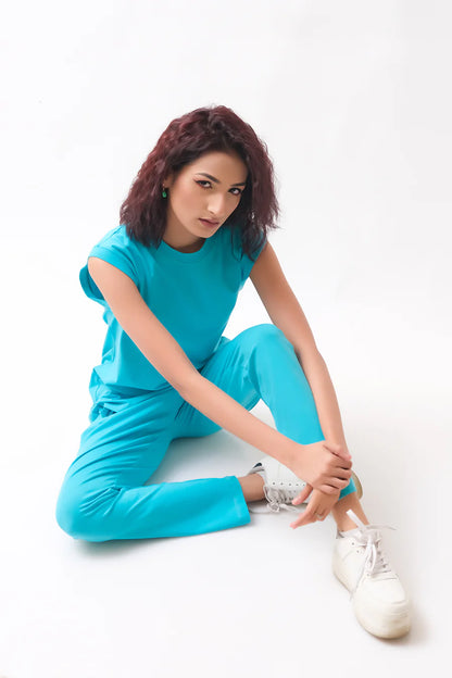 Turquoise sleeveless tunic paired with matching jogger pants set, relaxed fit