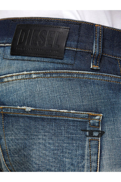 Men's blue jeans with Diesel leather logo patch on waistband