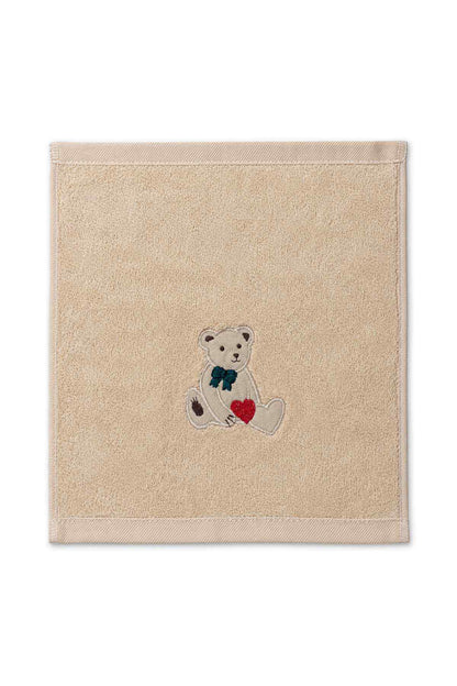 Baby washcloth square in light tan with centered teddy bear and red heart