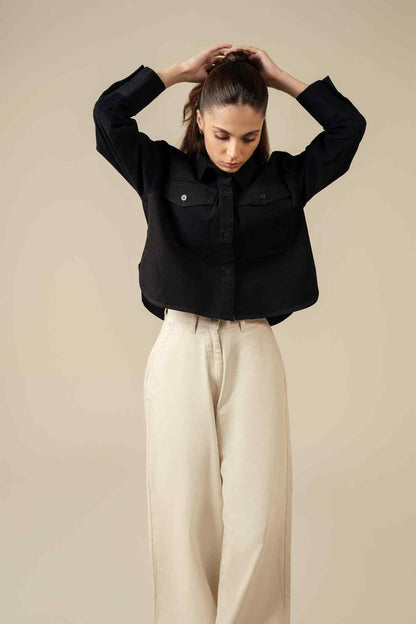 Miles black cropped button-front jacket with flap pockets, relaxed long sleeves