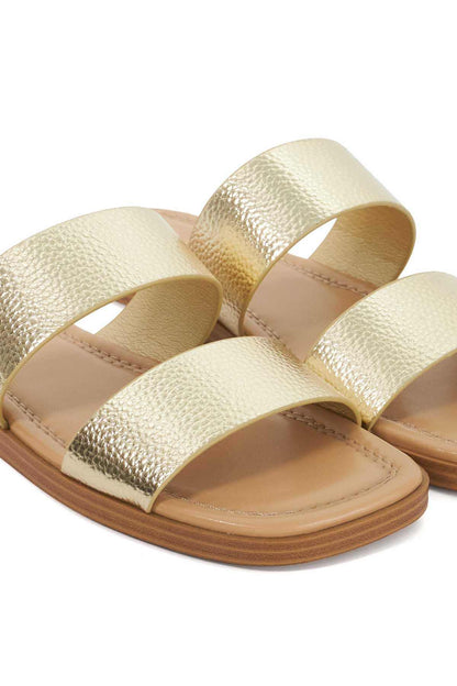 Gold metallic two-strap slide sandals, pair view with textured straps