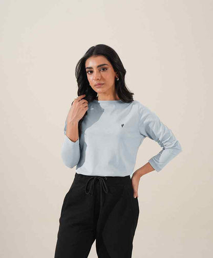 Sky blue fitted mock-neck long-sleeve top, small chest logo detail
