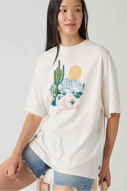 White graphic T-shirt, desert cactus print and sunset-style text on front