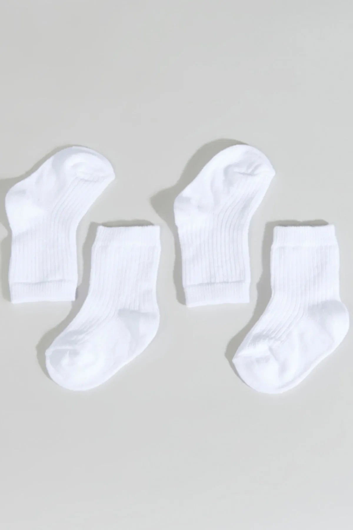 Set of four white baby ribbed crew socks