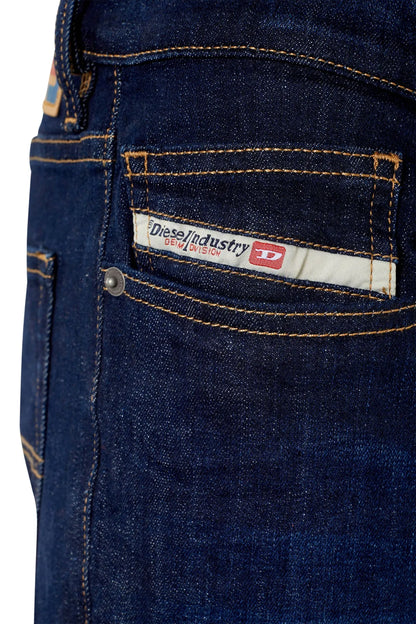 Dark blue denim jeans care label and stitched pocket details