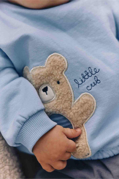 Light blue baby sweatshirt with teddy bear applique and 'Little Cubs' embroidery on chest