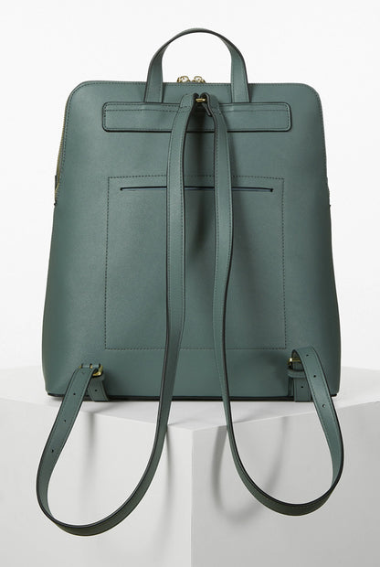 Green backpack with front flap, gold hardware, and adjustable shoulder straps