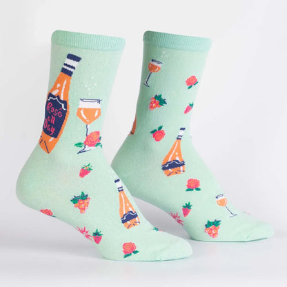 Mint green crew socks, side view, with rose and orange drink novelty print