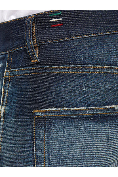 Men's blue jeans waistband and button with contrast stitching