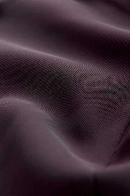 Dark purple blazer fabric texture close-up