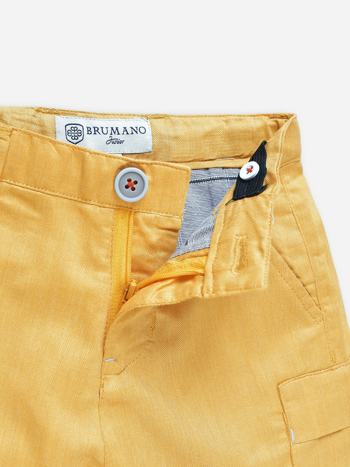 Yellow cotton shorts close-up: button fly, stitched pockets, logo patch