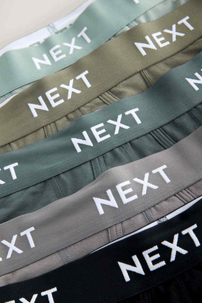 NEXT boxer shorts waistband detail with repeating NEXT logo on green and black