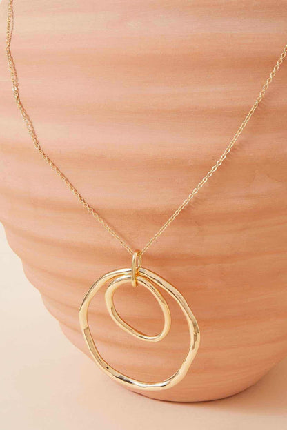 Gold chain necklace with layered oval pendant