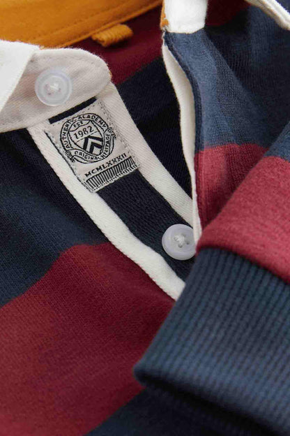 NEXT polo shirt close-up: white placket with buttons and logo patch